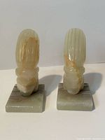 Front view of both carved marble bookends