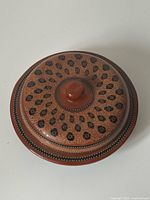 Top view of lacquerware bowl with lid showing decorative pattern