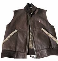 Front view of brown leather shearling vest fully unzipped showing inner shearling