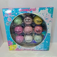 Front of sealed Body & Earth bath bomb gift set showing nine bombs and scent labels