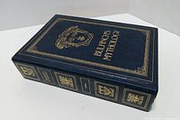 Front cover showing title, decorative border and emblem