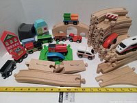 Overall set showing track pieces, vehicles, buildings, ruler for scale