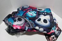 Folded Nightmare Before Christmas graphic pullover hoodie showing character faces and vibrant colors