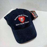 Front view of cap, showing embroidery and hang tag