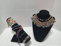 Overall view of necklace and bracelets on displays