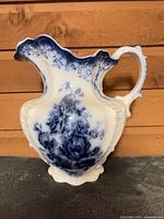 Full view of pitcher front showing pattern and form