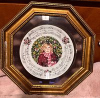 Front view showing plate design and octagonal gold frame