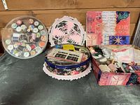 Overview of three containers with sewing supplies