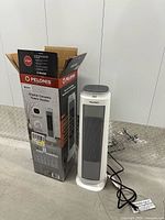 Heater standing beside original Pelonis box