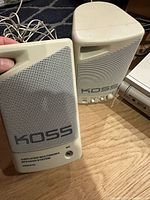 Two Koss amplified multimedia speakers, front view showing grilles and controls