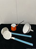 Group shot of four enamelware items