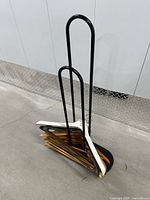 Overall view of metal hanger stand loaded with hangers