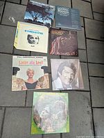 Seven album covers laid out indicating variety and count