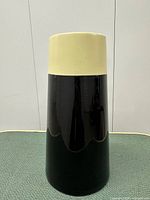 Full view of tall cylindrical vase showing color scheme and form