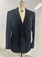 Front view of black velvet blazer on mannequin