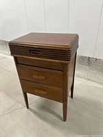 Front left view of wooden sewing caddy