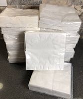 Stack of fourteen sealed napkin packs