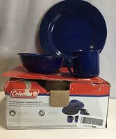 Boxed Coleman enamel dinnerware set showing one plate, bowl and mug