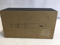 Front view of sealed Füm diffusive device box showing product silhouette and branding
