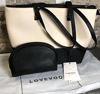 Tote purse front with travel pouch and dust bag