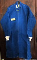 Full view of blue arc flash coat with knit cuffs