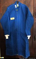 Full front view of blue arc flash coat on hanger