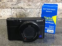 Front view of Sony RX100 III camera with battery pack packaging