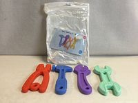 Four silicone teething toys in red, blue, purple and mint with packaging