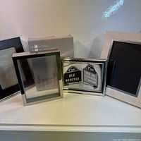 Group shot of all four frames and Indigo box