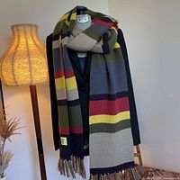 Full view of multicolour striped scarf draped on mannequin