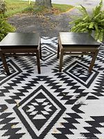 Both side tables shown together on rug