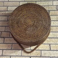 Top view of round woven basket showing spiral weave pattern