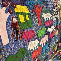 Close-up applique animals, houses, embroidered details