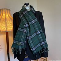 Full scarf draped over blazer to show size and drape