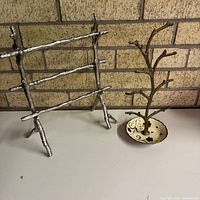 Both jewelry stands side by side on surface