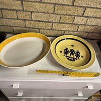 Both platters side by side with tape for scale