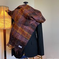 Scarf draped on mannequin showing overall size and colour pattern