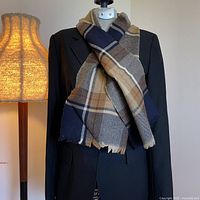 Full view of scarf draped on blazer, showing pattern and length