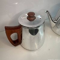 Coffee pot without visible spout, wood handle, lid knob