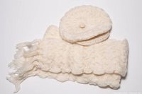 Folded scarf with fringed ends and matching cap top view