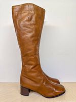 Full left side view of boot showing overall height and leather finish