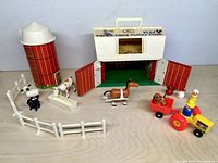 Full playset layout showing barn, silo, animals, tractor, cart, fences
