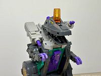 Upper body of Trypticon showing head, arms, battery area