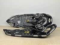 Top view of both Atlas 9 25 Trail snowshoes stacked showing bindings and frame