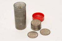 Tube, cap removed, token stack and loose token