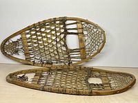 Full view of both snowshoes showing size, shape and condition