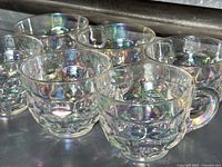 Group of six iridescent thumbprint punch cups