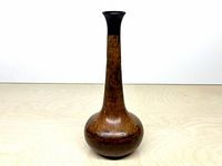 Full view of copper vase showing shape and patina