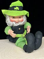 Full view of leprechaun doll seated showing outfit and size