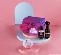 Gift set staged: wrapped box, body spray, shower gel, bath bomb